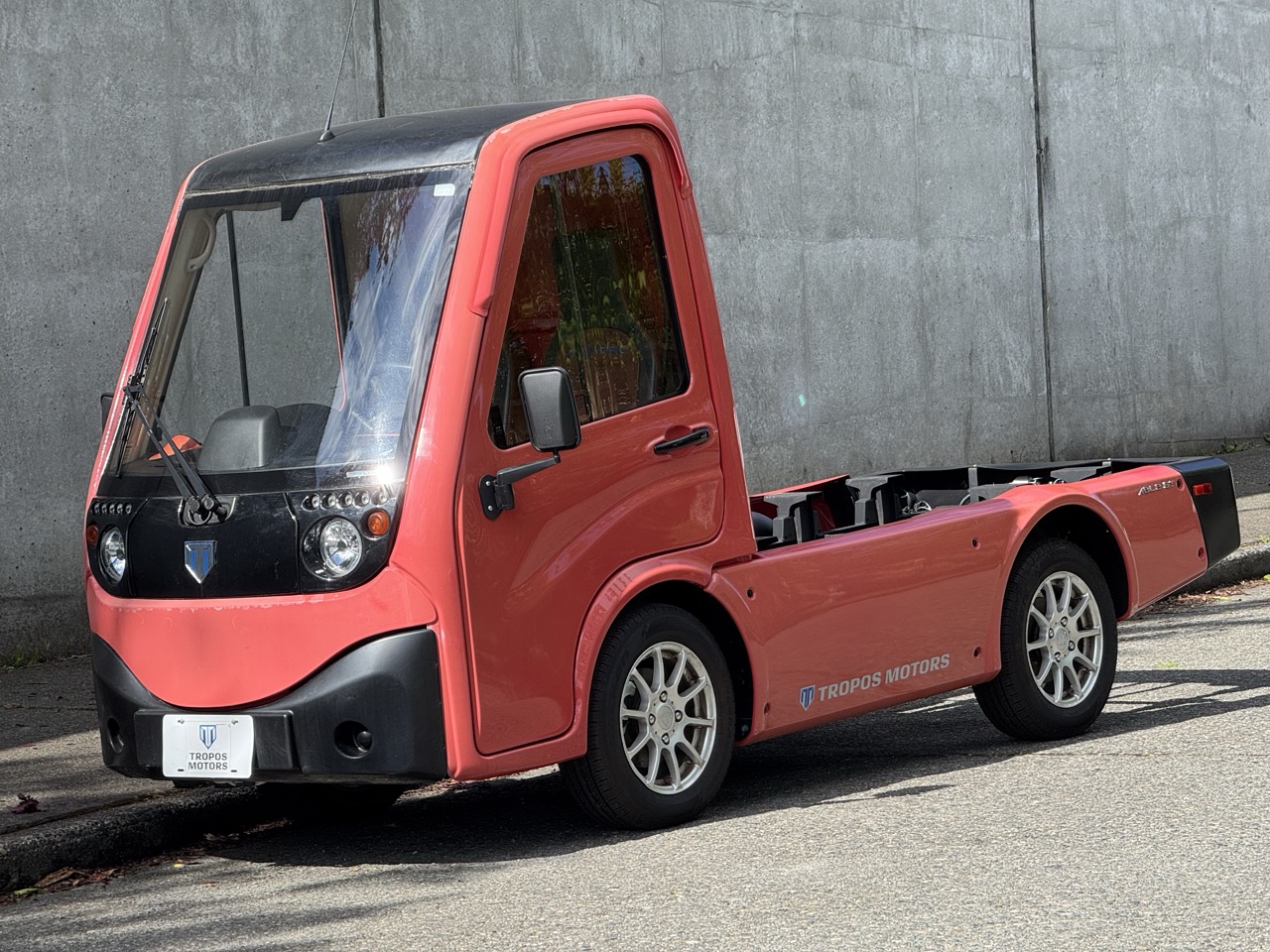 Cute, small red pickup like utilty vehicle